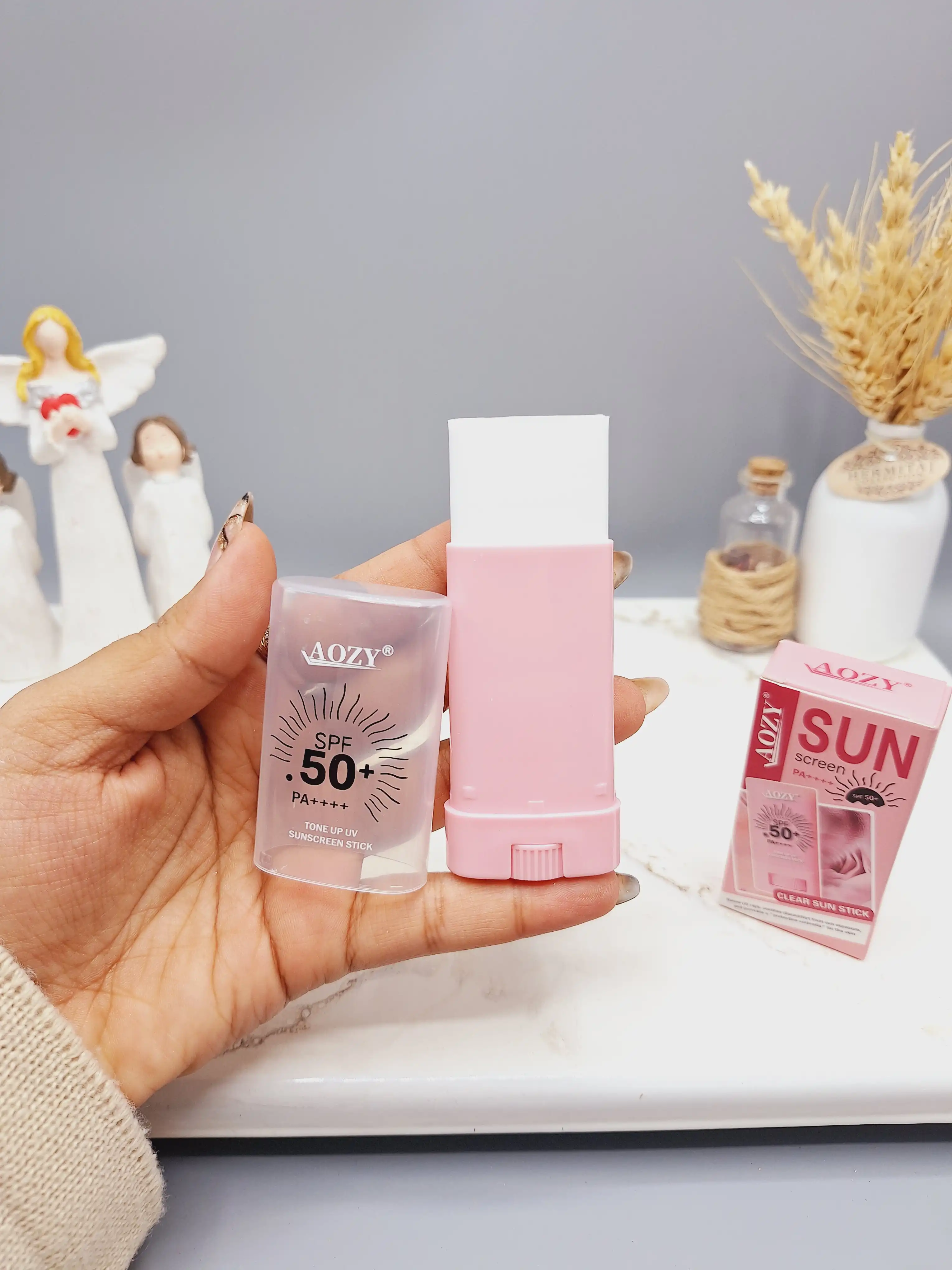 ضد آفتاب بی رنگ استیکی SPF 50 مناسب در برابر آفتاب با رایحه گل کد AB008